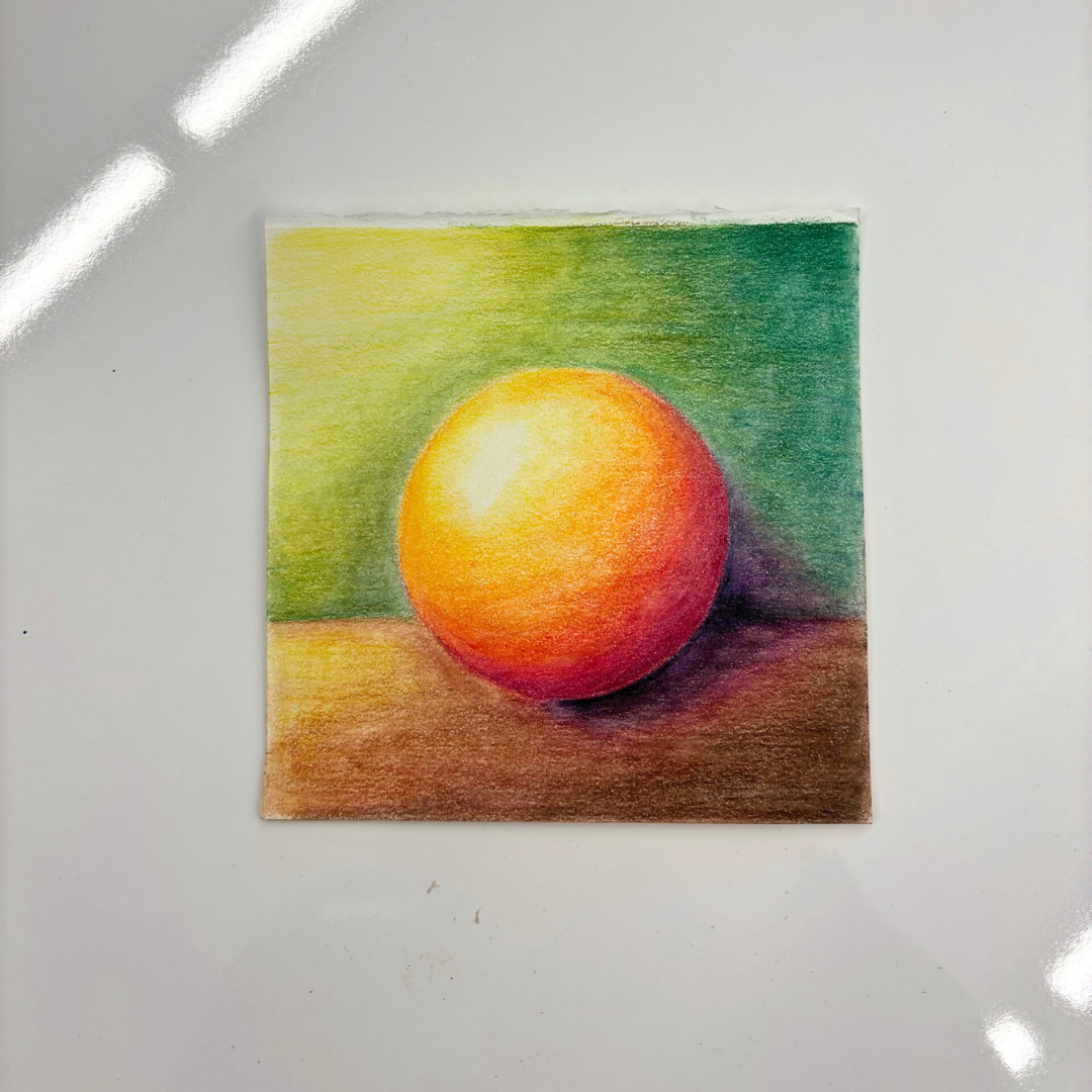 A color pencil artwork on a white table.
